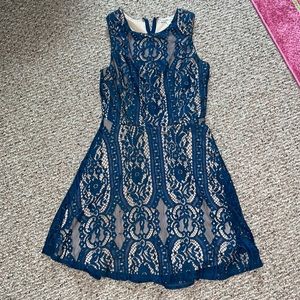 Blue lacy sleeveless dress.